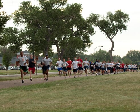 Runners participate in a 5K race held here in conjunction with Frontiercade 2011 Aug. 19. Frontiercade is Warren's annual summer event where units, large and small, and their families can get together for fun. (U.S. Air Force photo by Matt Bilden)