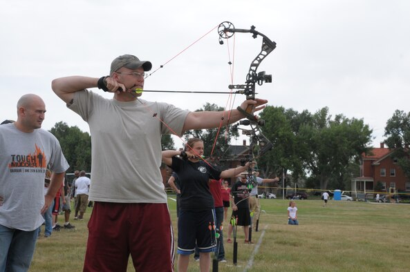 Team 6 Archery member Staff Sgt. James Herzog, 15th Munitions Squadron, takes careful aim at his target during Frontiercade 2011, Aug. 19. (U.S. Air Force photo by Blaze Lipowski)
