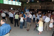 HANSCOM AIR FORCE BASE, Mass. – A large crowd gathers in the Aero Club Hangar to learn all about programs from the Electronic Systems Center during the ESC Showcase Aug. 22. The entire Hanscom community was invited to the showcase during the day and community leaders attended the showcase later that night. (U.S. Air Force photo by Rick Berry)