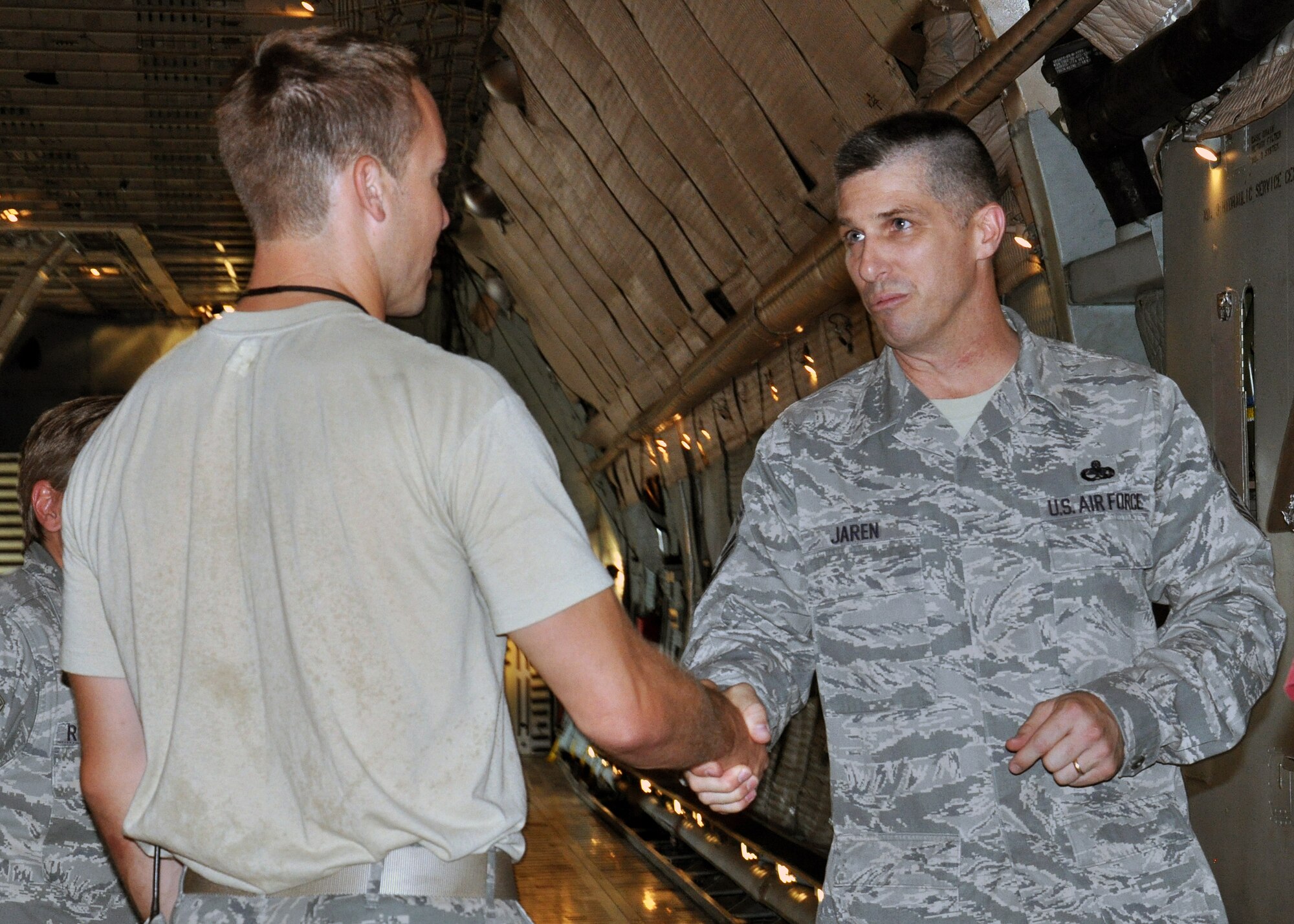 WRIGHT-PATTERSON AIR FORCE BASE, Ohio - Chief Master Sgt. Eric R. Jaren, Air Force Materiel Command command chief, enjoys talking with 445th Aircraft Maintenance members who were working on a C-5 Galaxy as he toured the aircraft during his visit to the 445th Airlift Wing Aug. 11. (U.S. Air Force photo/Staff Sgt. Amanda Duncan)