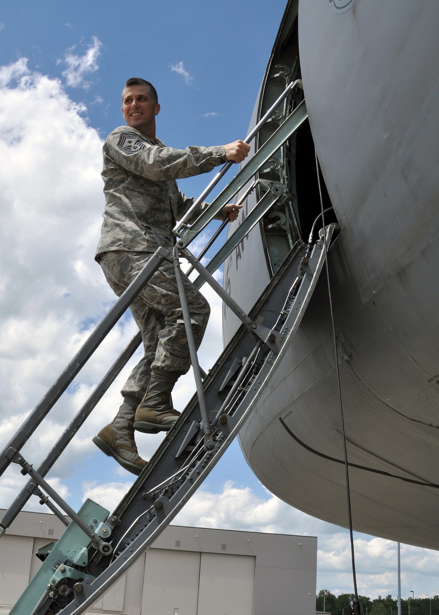 WRIGHT-PATTERSON AIR FORCE BASE, Ohio - Chief Master Sgt. Eric R. Jaren, Air Force Materiel Command command chief, climbs up the ladder of a 445th Airlift Wing C-5 Galaxy during his visit to the wing Aug. 11. (U.S. Air Force photo/Staff Sgt. Amanda Duncan)