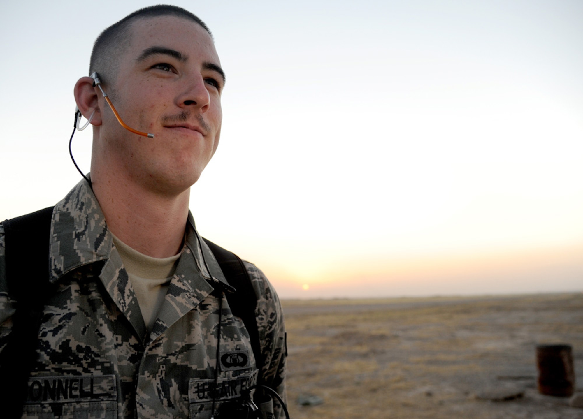 Air Force Senior Airman David O'Connell, radar approach control, helps planes get to their destinations quickly and safely at Kirkuk Air Base, Iraq. Airman O'Connell helps provide weather, safe altitudes, and traffic patterns for flights  and destinations. (U.S. Air Force photo by Senior Airman Tristin English)