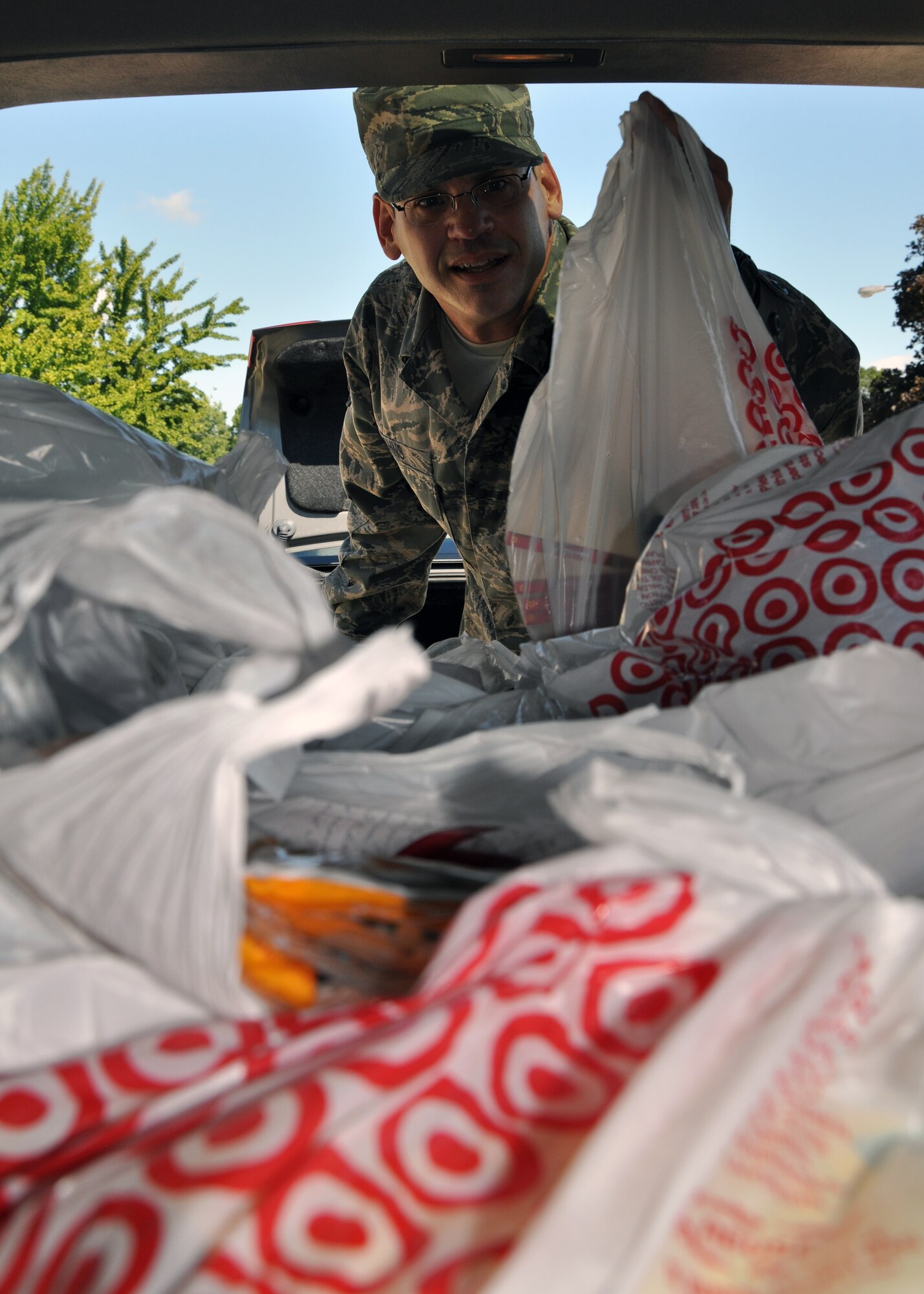 WRIGHT-PATTERON AIR FORCE BASE, Ohio – Representing the 445th Airlift Wing Human Resources Development Council, Master Sgt. Anthony Johns, 445th Operations Support Squadron first sergeant, transfers 778 items of donated school supplies and clothing donated by the Wing Aug. 10 for the school aged children in the American Indian/Alaska Native Program. In conjunction with Wright-Patterson Air Force Base efforts in partnership with the Miami Valley Council for Native Americans and Sunwatch Village, the collected items will go to the children of the Rosebud, Crow Creek, Cheyenne River, Standing Rock, and Sisseton-Wahpeton Reservations in South Dakota. (U.S. Air Force photo/Staff Sgt. Amanda Duncan)