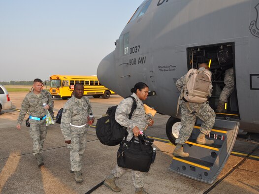 Tech. Sgt. Jason Carmack, Tech. Sgt. Otis Luke and Maj. Marla Powell are among the 908th Airlift Wing reservists departing on C-130 Hercules aircraft Saturday for Muniz Air National Guard Base in San Juan, Puerto Rico, to support Coronet Oak operations. (Air Force photo/Lt. Col. Jerry Lobb)