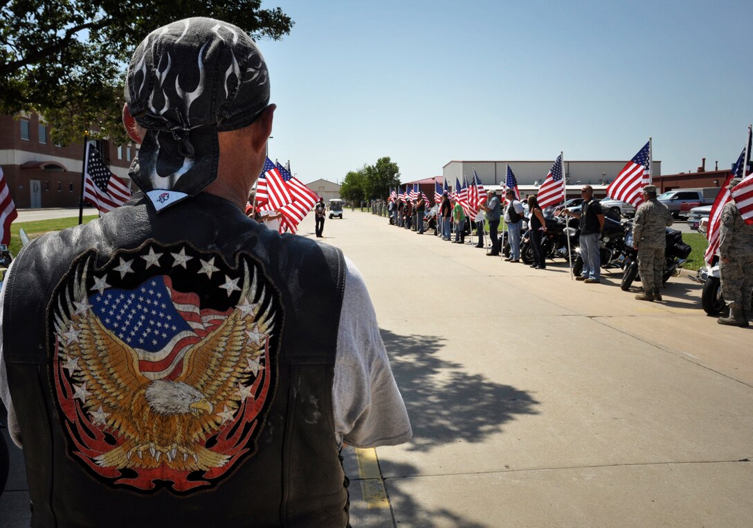 Patriot Guard riders as well as Oklahoma Army and Air National Guardsmen await the opportunity to pay their respects, as the procession of Army Specialist Joshua M. Seals departs the Oklahoma Air National Guard base in Tulsa, OK.  Specialist Seals was a member of the 45th Infantry Brigade, Oklahoma National Guard, serving on Operation Enduring Freedom in Afghanistan.  (U.S. Air Force photo by Master Sergeant Preston L. Chasteen)