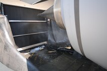 Water drains out of a CFM International CFM56 engine (F108 military designation) on a KC-135R Stratotanker during an ECO System engine cleaning at Scott AFB, Ill., on August 24, 2011. A collector placed beneath the engine catches the deionized, chemical free water allowing it to be recycled back into the ECO System for filteration and reuse. The 126th Air Refueling Wing, Illinois Air National Guard, is participating in the engine wash as a fuel conservation measure. Washing the engine is expected to reduce the Exhaust Gas Temperature (EGT) margin by 5-6 degrees resulting in fuel savings and longer engine life. (U.S. AF photo by Master Sgt. Ken Stephens) (Released)