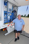 Mike Ashmore, an Eco Wash Team member from Pratt & Whitney, Dallas, Tex., monitors the control panel of the ECO System engine washer during the cleaning of a CFM International CFM56 engine (F108 military designation) on a KC-135R Stratotanker at Scott AFB, Ill., on August 24, 2011. The 126th Air Refueling Wing, Illinois Air National Guard, is participating in the engine wash as a fuel conservation measure. Washing the engine is expected to reduce the Exhaust Gas Temperature (EGT) margin by 5-6 degrees resulting in fuel savings and longer engine life. (U.S. AF photo by Master Sgt. Ken Stephens) (Released)
