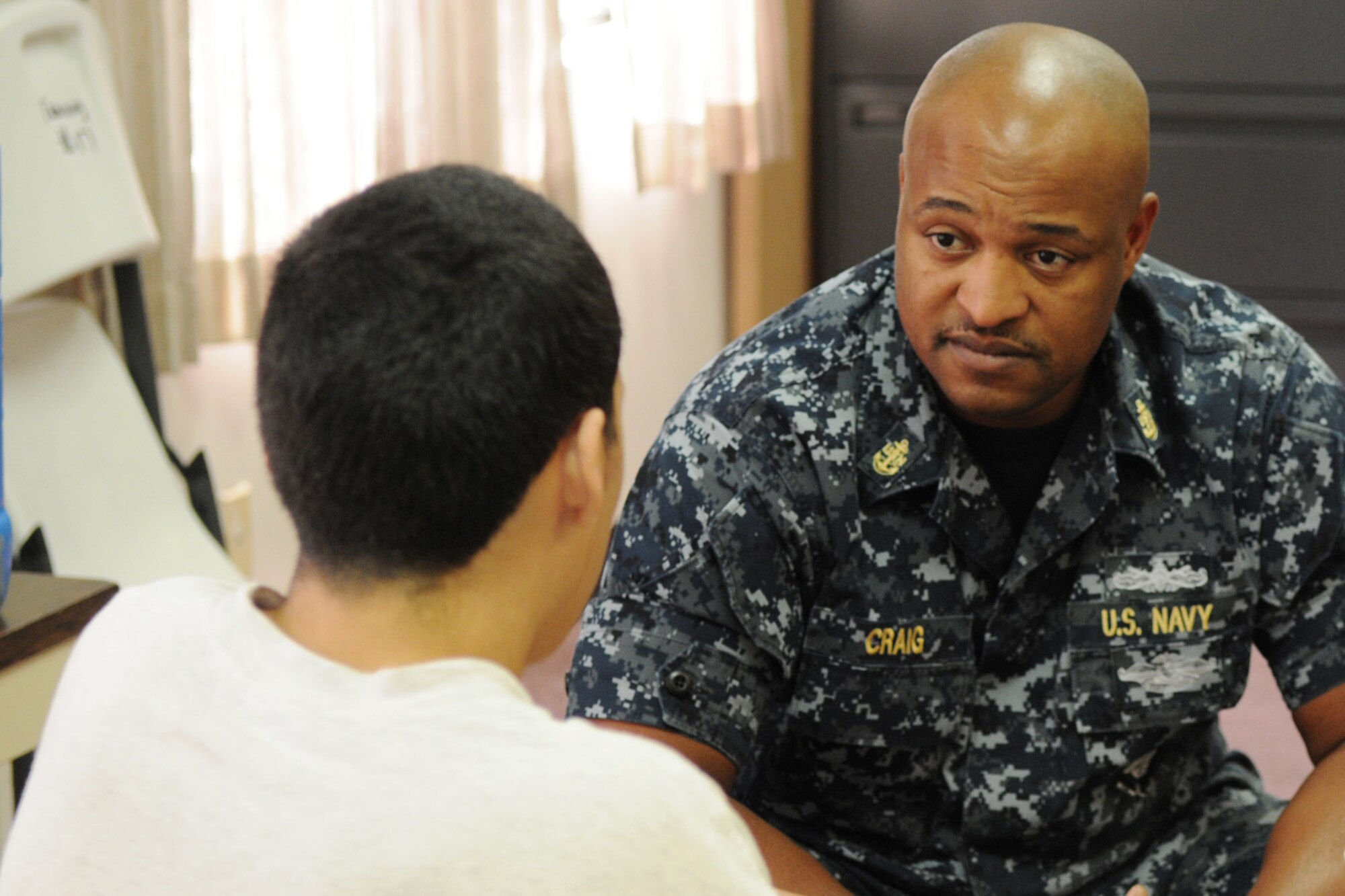 Chief Petty Officer Nikki Craig, a U.S. Navy independent duty corpsman with Naval Technical Training Center (NTTC) Lackland, visits with a youth at the Hector Garza Residential Treatment Center in San Antonio, Texas, August 12, 2011. (Air National Guard Photo by SSgt Phil Fountain/Released)
(U.S. Air Force photo/Staff Sergeant Phil Fountain)