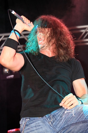 Beaux Foy, Airiel Down lead singer, hypes up the Iwakuni crowd during their headline Summer Music Festival Open House performance at the Torii Pines golf course here Saturday. Approximately 4,500 station and local residents gathered to celebrate the first ever open house event.