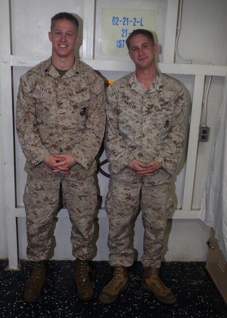 Cpl. Christopher R. Taylor, left, landing support specialist with Combat Logistics Battalion (CLB) 22, 22nd Marine Expeditionary Unit (MEU), and Lance Cpl. John D. Taylor, right, a field radio operator with Echo Company, Battalion Landing Team (BLT), 2nd Battalion, 2nd Marine Regiment, 22nd MEU, pose for a picture aboard dock landing ship USS Whidbey Island (LSD 41), Aug. 26, 2011. The 22nd MEU is currently deployed as part of the Bataan Amphibious Ready Group (BATARG) as the U.S. Central Command theatre reserve force, also providing support for maritime security operations and theater security cooperation efforts in the U.S. 5th Fleet area of responsibility.