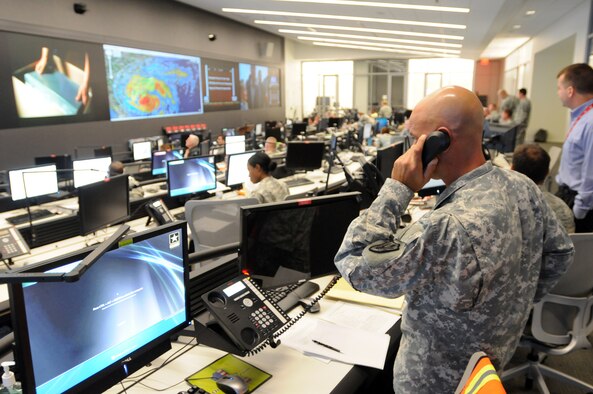 With about 101,000 National Guard members ready to assist eastern seaboard states in the path of Hurricane Irene, Guardsmen at the National Guard Coordination Center in Arlington, Va., seen here Aug. 26, 2011, are monitoring the storm and National Guard support to civilian authorities around the clock. (U.S. Army photo/Staff Sgt. Jim Greenhill)