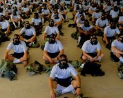 Air Force basic military trainees from the 326th Training Squadron listen to instructions during their chemical, biological, radiological, nuclear and high-yield explosives (CBRNE) training July 26 at Lackland Air Force Base. CBRNE includes a visit to the gas chamber, contamination avoidance and decontamination procedures. (U.S. Air Force photo/Staff Sgt. Sharida Jackson)
