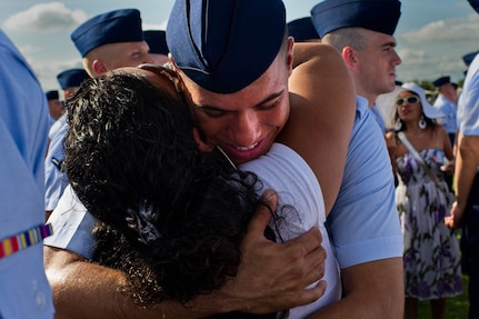 Airman Basic Corinthian Maldonado is greeted by his sister, Samantha Labron, for the first time since leaving for basic military training July 29 at Lackland Air Force Base. The 8 1/2-weeks-long program graduates more than 35,000 Airmen annually. (U.S. Air Force photo/Staff Sgt. Jonathan Snyder)