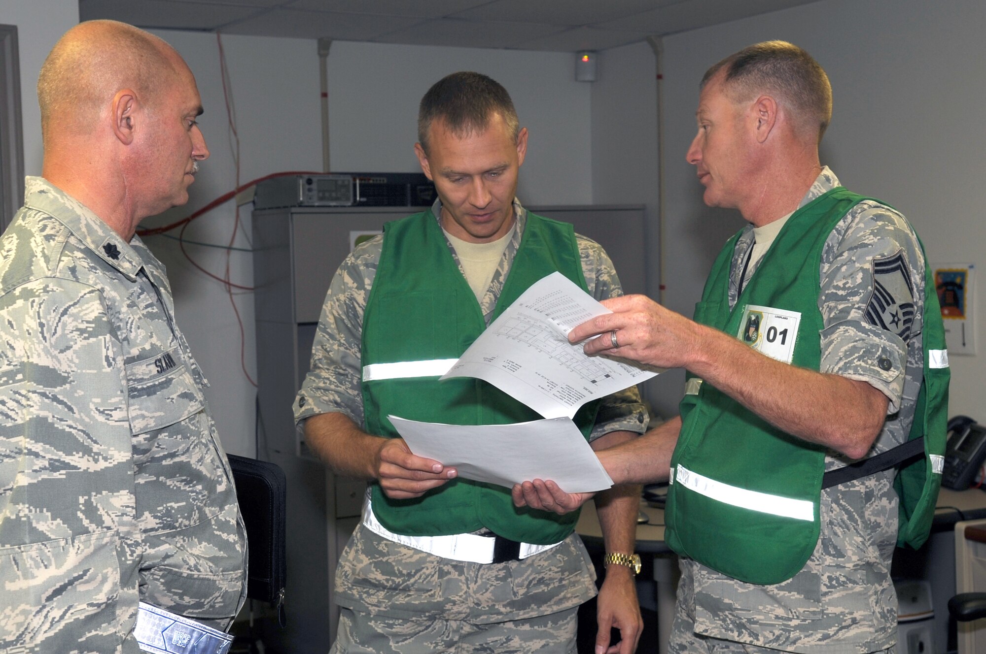 Senior Master Sgt. Rodney Kennedy briefs Capt. Michael Larimore and Lt. Col. Al Slavin, all of the 442nd Logistics Readiness Squadron, during the phase-one operational readiness inspection, August 2011. During the inspection, LRS is responsible for ensuring all aircraft take off on time and all Airmen and cargo set to "deploy" are scheduled and able to head to the area of responsibility. The 442nd LRS is part of the 442nd Fighter Wing, an A-10 Thunderbolt II Air Force Reserve unit at Whiteman Air Force Base, Mo. (U.S. Air Force photo/Staff Sgt. Danielle Wolf)