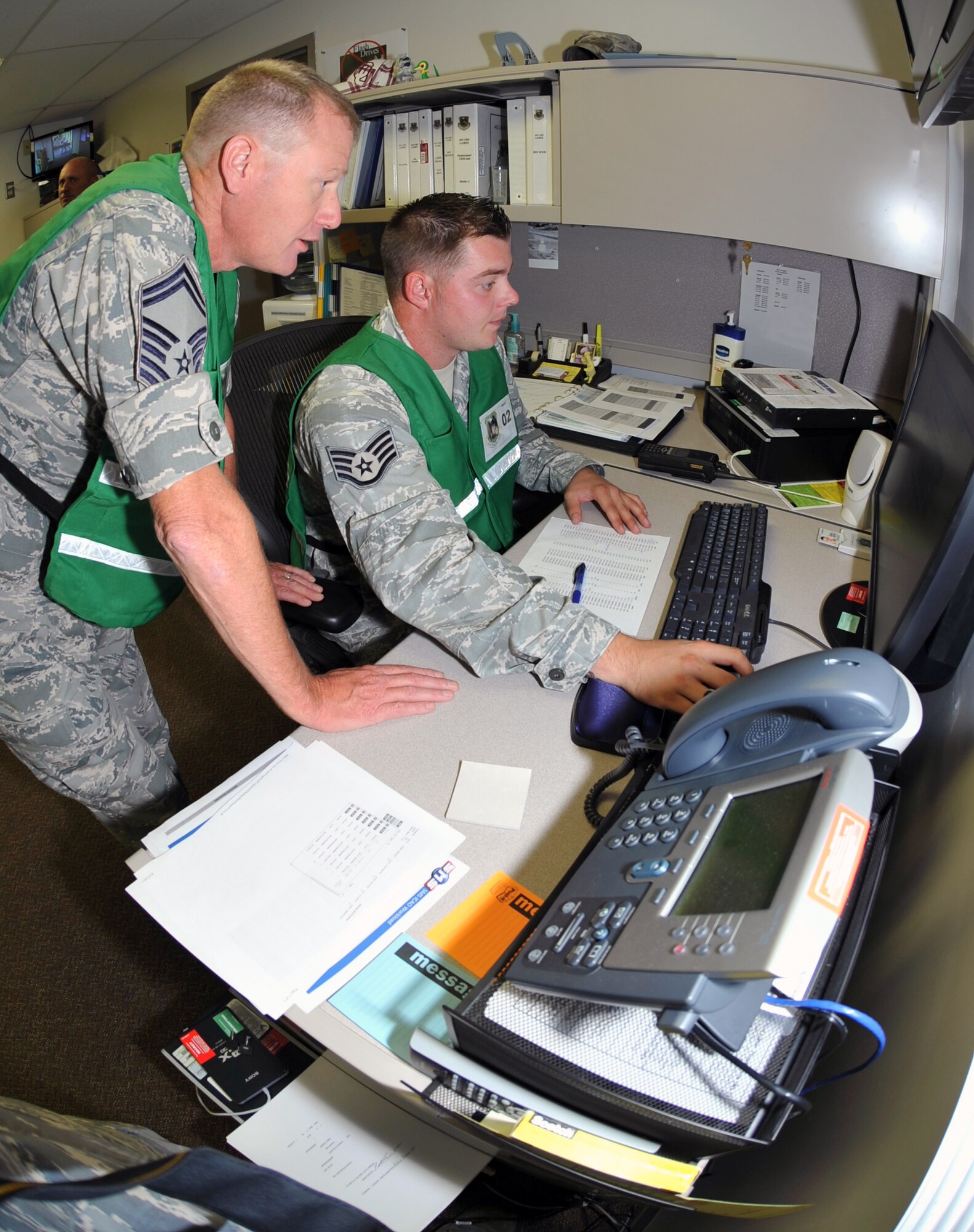 Senior Master Sgt. Rodney Kennedy and Staff Sgt. Peter Koontz, both of the 442nd Logistics Readiness Squadron, are key players for the phase-one operational readiness inspection, August 2011. During the inspection, they are responsible for ensuring all aircraft take off on time and all Airmen set to "deploy" are scheduled and able to head to the area of responsibility. The 442nd LRS is part of the 442nd Fighter Wing, an A-10 Thunderbolt II Air Force Reserve unit at Whiteman Air Force Base, Mo. (U.S. Air Force photo/Staff Sgt. Danielle Wolf)