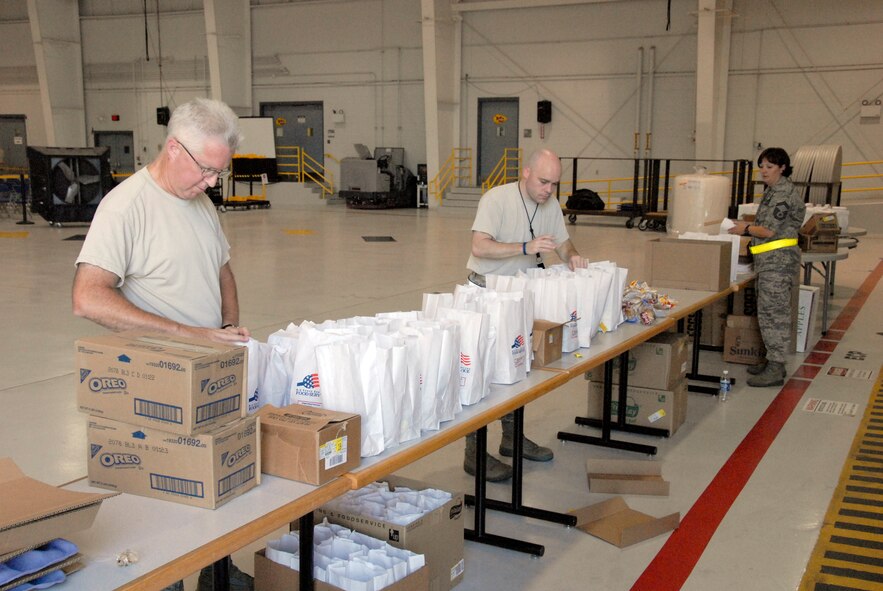 Tech. Sgt. Bob Dodge, hydraulics technician, and Tech. Sgt. Alan Haas, chaplain assistant, both of the 442nd Fighter Wing, prepare lunches for reservists in preparation of the phase-one operational readiness inspection, August 2011. The 442nd FW is an A-10 Thunderbolt II Air Force Reserve unit at Whiteman Air Force Base, Mo. (U.S. Air Force photo/Tech. Sgt. Kent Kagarise)