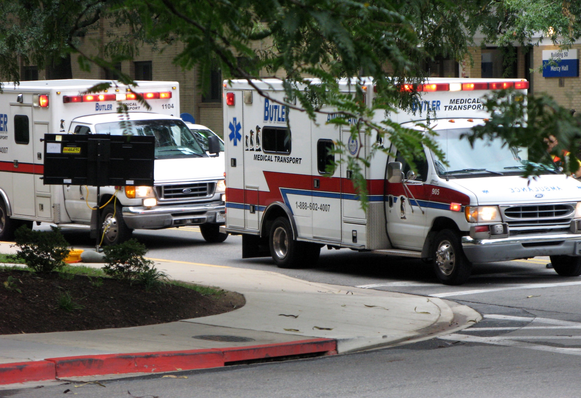 Ambulances line up at the National Naval Medical Center in Bethesda, Md., Aug. 27, 2011, carrying some of the last 18 patients being transferred from Walter Reed Army Medical Center in Washington D.C.  (Defense Department photo/Donna Miles)