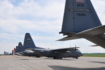 YOUNGSTOWN AIR RESERVE STATION, Ohio -- Five North Carolina-based C-130s and their aircrews seeking refuge from Hurricane Irene turned up on the flightline here, August  26, 2011. Four C-130Hs from Air Force Reserve Command's 440th Airlift Wing, based at Pope Air Force Base, North Carolina and one C-130J from Elizabeth City Coast Guard Station, North Carolina were evacuated to YARS as a precautionary measure to prevent damage to the aircraft as the U.S. eastern coast braced for Hurricane Irene to make landfall this weekend. For more information about Hurricane Irene, visit the NOAA website using this link: http://www.noaawatch.gov/2011/tc_at09.php.  U.S. Air Force photo by Master Sgt. Bob Barko Jr. 