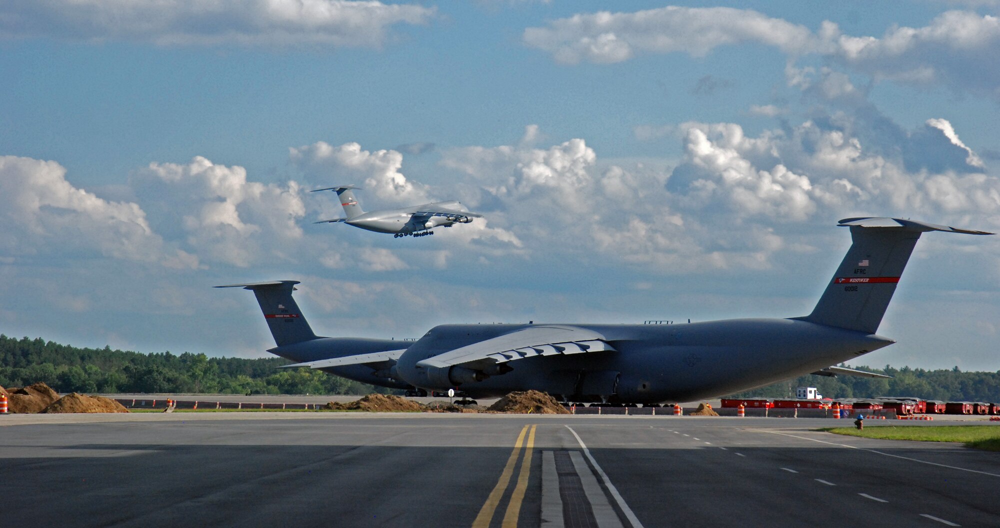 All but two of Westover Air Reserve Base’s C-5 aircraft were evacuated Aug. 26 - 27 to bases in Florida, Delaware and Ohio, in preparation for Hurricane Irene. In addition, 61 trailers loaded with bottled water, generators, tarps, food, and other emergency supplies arrived at Westover Aug. 26 and 27 as the base partnered with the Federal Emergency Management Agency in preparation for the hurricane, which hit New England Sunday, Aug. 28. (US Air Force photo/SrA. Kelly Galloway)
