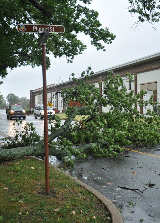 A fallen tree obstructs traffic at the intersection of Plumb Street and Sweeney Boulevard at Langley Air Force Base, Va., as Hurricane Irene approaches the area Aug. 27, 2011. Joint Base Langley-Eustis implemented evacuations, base closures and infrastructure protection measures to mitigate storm damage at Langley AFB and Fort Eustis. (U.S. Air Force photo by Senior Airman Jason J. Brown/RELEASED)