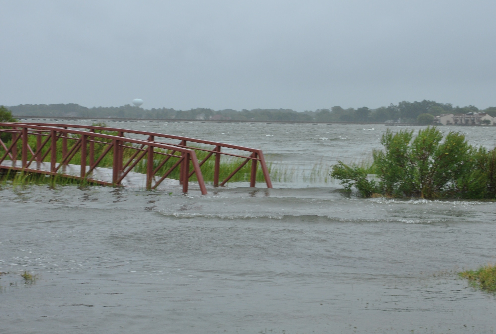 The Back River spills over the seawall into Eagle Park at Langley Air Force Base, Va., as Hurricane Irene approaches the area Aug. 27, 2011. Irene made landfall in North Carolina becoming the first hurricane to hit the continental United States since 2008. (U.S. Air Force photo by Senior Airman Jason J. Brown/RELEASED)