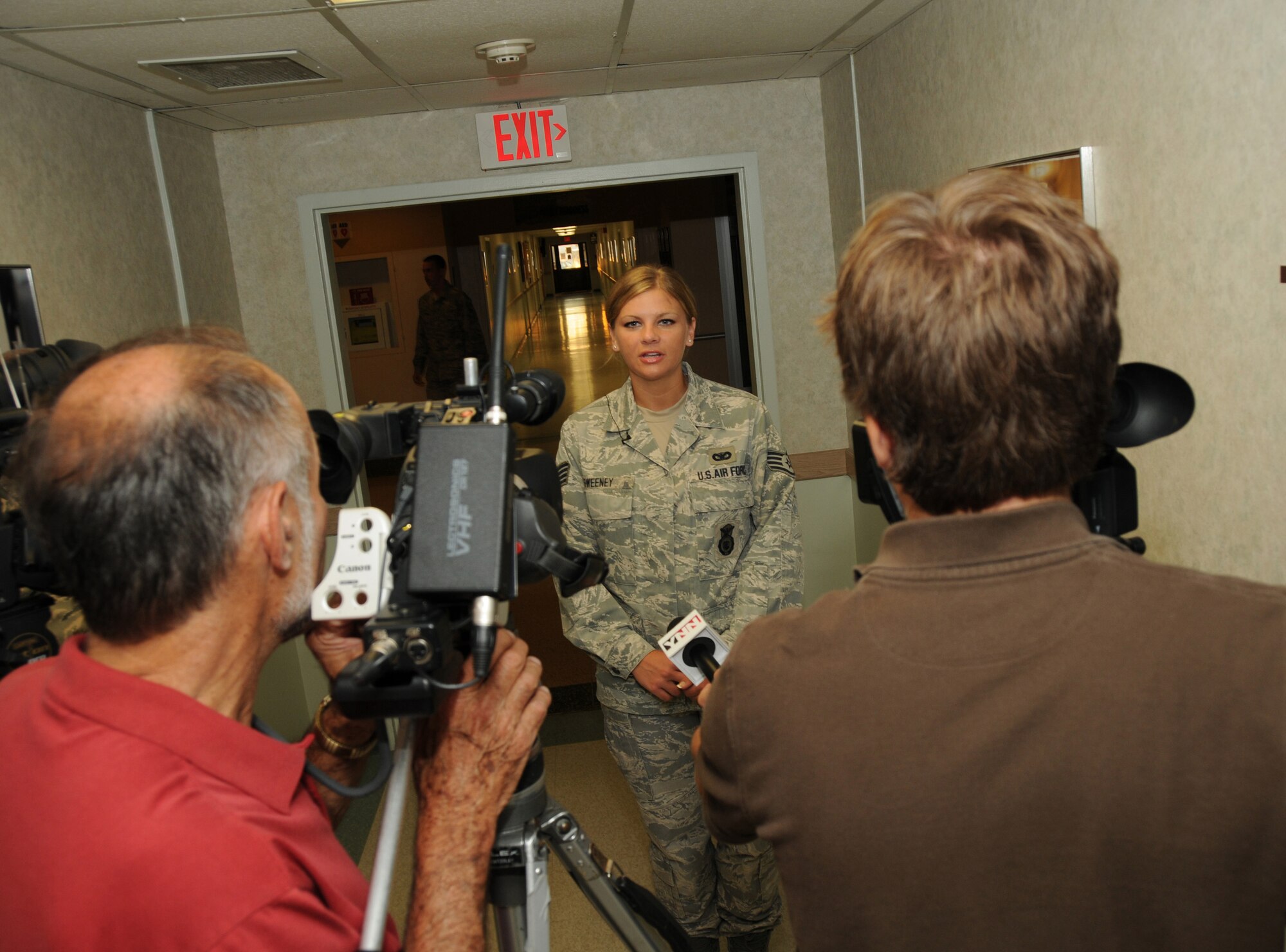 On Saturday, Aug. 27, the 107th Airlift Wing  deployed 45 Airmen as part of TASK FORCE IRENE will be stationed at Camp Smith near Albany NY. These airmen will remain in place at the center to ride out the storm and then immediately respond to aid civil authorities as directed in New York City. Staff Sergeant Kelli Sweeny is interviewed by Buffalo, NY local media before she deploys with her fellow airman. (Air Force Photo/SMSgt Ray Lloyd)