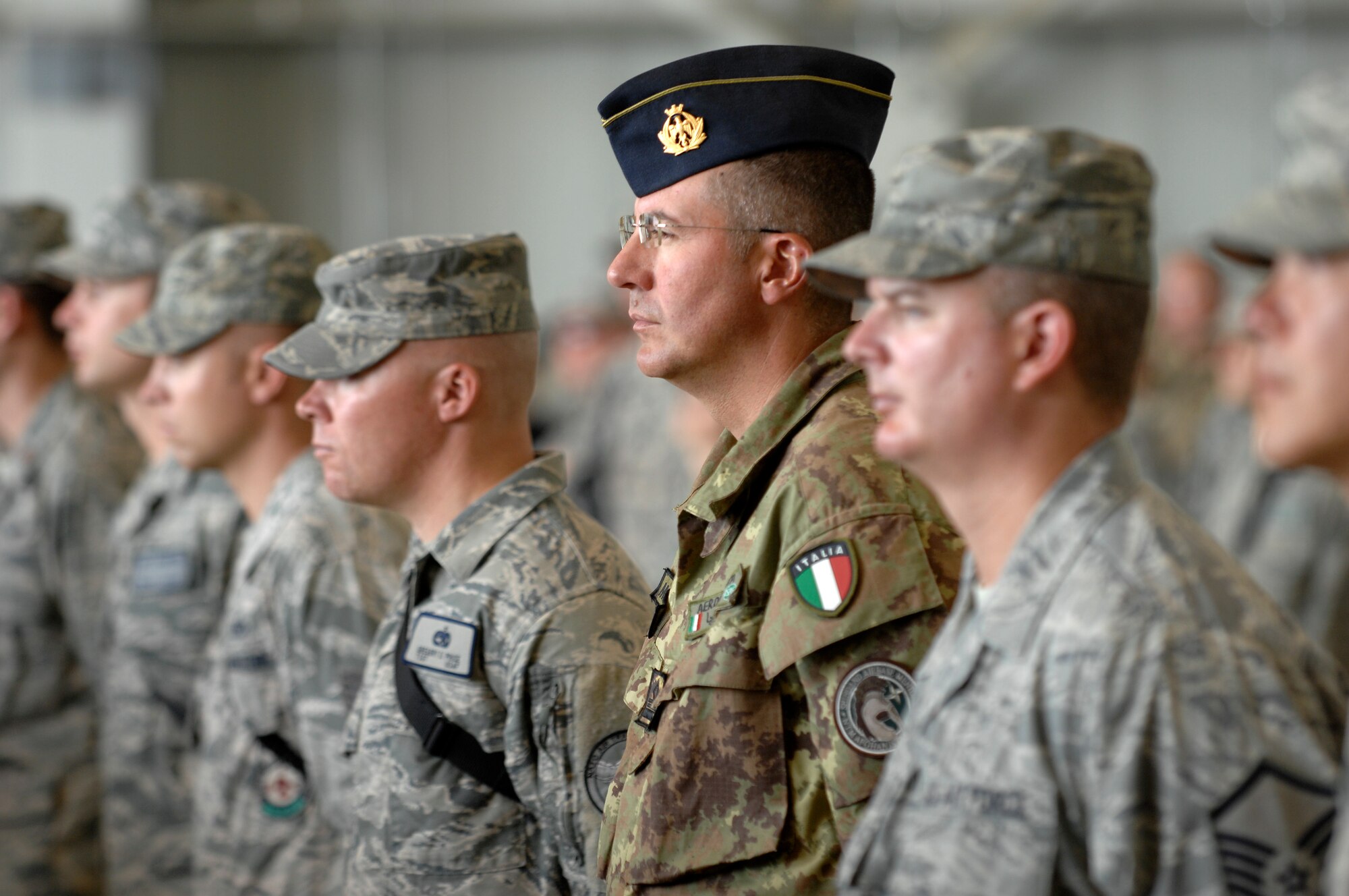 A member of the Italian Air Force stands at attention during a change of command ceremony, Kabul International Airport, August 27, 2011. Brig. Gen. Tim Ray took over command from Brig. Gen. David Allvin as 438th AEW commander.  (U.S. Air Force photo by Staff Sgt. Matt Smith)