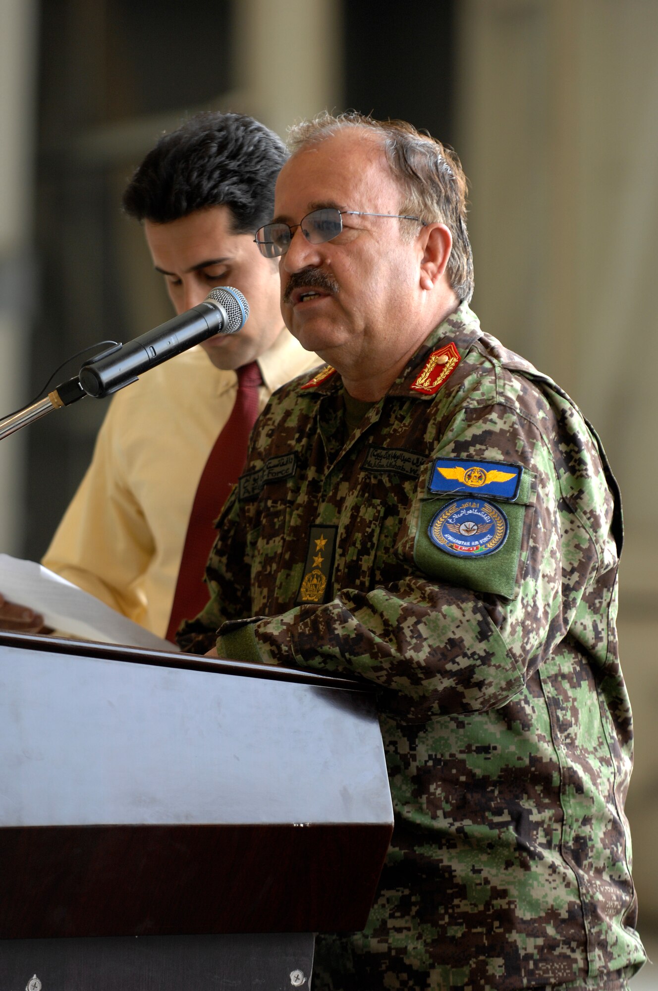 Maj. Gen. Abdul Wahab Wardak, Afghan Air Force commander, speaks during a change of command ceremony, Kabul International Airport, August 27, 2011. Brig. Gen. Tim Ray took over command from Brig. Gen. David Allvin as 438th AEW commander.  
