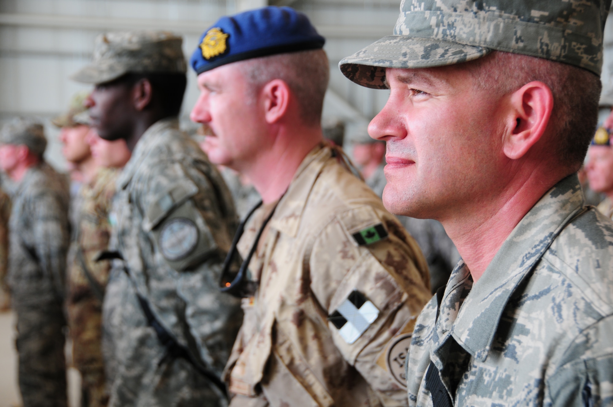 Members of the 438th Air Expeditionary Wing stand at parade rest during a change of command ceremony at Kabul International Airport, Kabul, Afghanistan August 27, 2011.  Brig. Gen. Tim Ray took over command from Brig. Gen. David Allvin as 438th AEW commander.  (U.S. Air Force photo by Senior Airman Amber Williams)