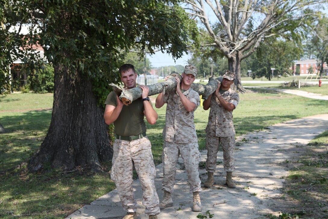 Marines with 8th Engineer Support Battalion, 2nd Marine Logistics Group, assist with cleanup at Marine Corps Base Camp Lejeune on Aug.  28 after Hurricane Irene.