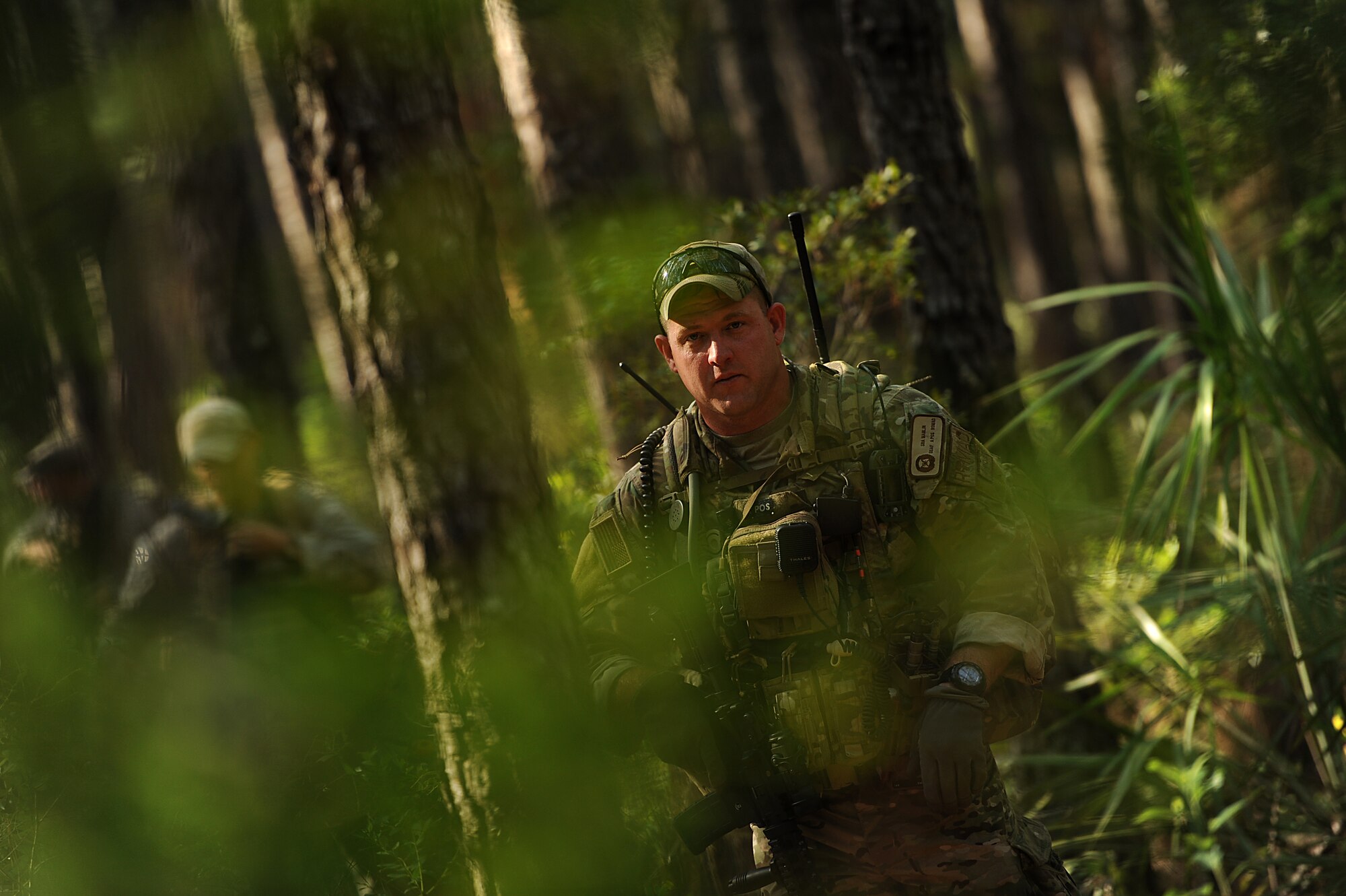 Tactical Air Control Party (TACP)  SrA. James Marlin with the 284th Air Support Operations Squadron (ASOS), Smokey Hill Range, KA takes lead as his team navigates through the woods to their next point on August 16, 2011 at Townsend Range during a three day field exercise in Brunswick, GA. The exercise, is the final phase of their 45 day training class "Project 175", hosted by the 165th ASOS, where they will bring everything they have learned throughout the course and apply it to this scenario earning them their five level. During exercises, contingencies, or actual war, the Air Support Operations mission is to provide meteorological support and deploy with, advise, and assist the ground force commander in planning, requesting, coordinating and controlling close air support, tactical air reconnaissance, and tactical airlift.