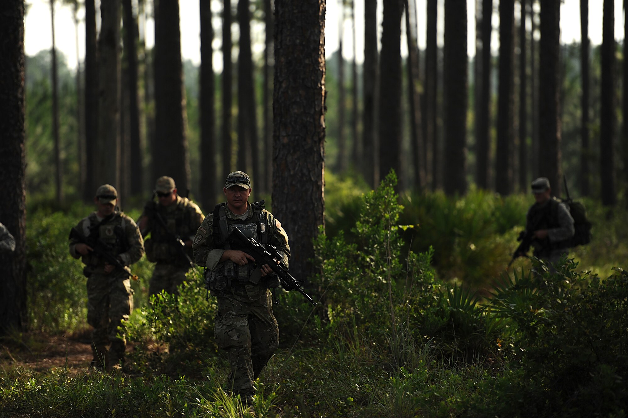 Tactical Air Control Party (TACP)  SrA. James Marlin with the 284th Air Support Operations Squadron (ASOS), Smokey Hill Range, KA takes lead as his team navigates to their next point on August 16, 2011 at Townsend Range during a three day field exercise in Brunswick, GA. The exercise, is the final phase of their 45 day training class "Project 175", hosted by the 165th ASOS, where they will bring everything they have learned throughout the course and apply it to this scenario earning them their five level. During exercises, contingencies, or actual war, the Air Support Operations mission is to provide meteorological support and deploy with, advise, and assist the ground force commander in planning, requesting, coordinating and controlling close air support, tactical air reconnaissance, and tactical airlift.