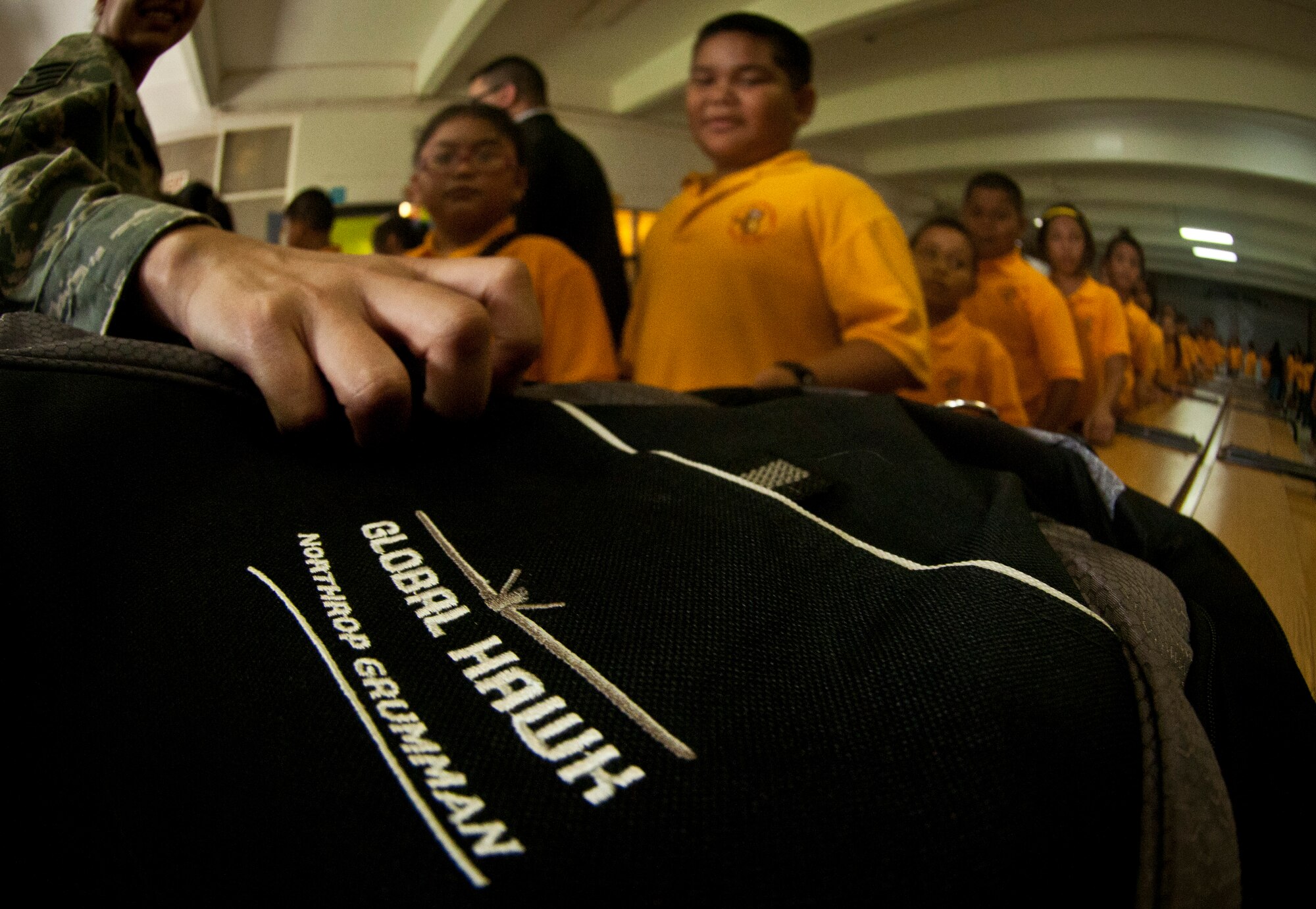 TALOFOFO, Guam— Personnel assigned to the 9th Operations Group Det. 3, which included civilian contracted workers along with active duty Air Force personnel, gave backpacks to local school children at the Talofofo Elementary School Aug. 25. Each backpack contained books, crayons, rulers, pencil, paper and other school supplies that the children need throughout the year. (U.S. Air Force photo by Senior Airman Benjamin Wiseman/Released)