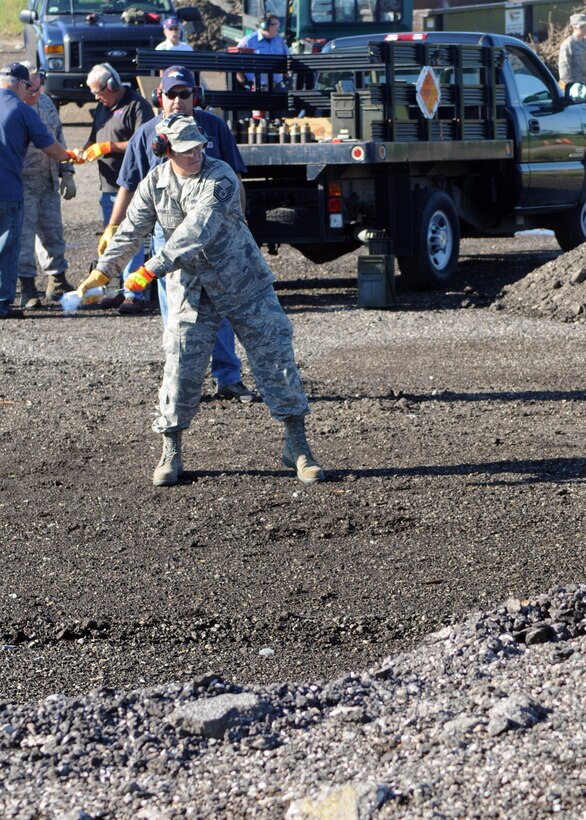 GRISSOM AIR RESERVE BASE, Ind. -- Master Sgt. Johnny Armes, 434th Air Refueling Wing safety manager, prepares to throw a ground burst simulator. GBS's are used to add realism to exercise and emergency response training.. (U.S. Air Force photo/Staff Sgt. Carl Berry)