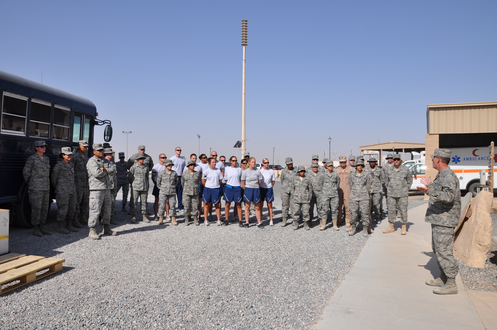 Members of the 386th Expeditionary Medical Group gather for the standing-up of the Patient Movement Item Hub Aug. 26 at an undisclosed location in Southwest Asia. (U.S. Air Force photo by Senior Airman Rachelle Elsea)