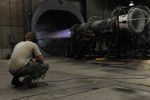 KUNSAN AIR BASE, Republic of Korea -- Senior Airman Kurt Ranes, 8th Maintenance Squadron aerospace propulsion journeyman, watches as an F-16 Fighting Falcon engine being tested here Aug. 25. The propulsion flight is a centralized repair facility responsible for facilitating maintenance on the jet engine around the clock. (U.S. Air Force photo/Senior Airman Brittany Y. Bateman)