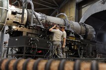 KUNSAN AIR BASE, Republic of Korea -- Senior Airmen Kurt Ranes and Eric MacPherson, 8th Maintenance Squadron aerospace propulsion journeymen, perform an inspection on an F-16 Fighting Falcon engine here Aug. 25. The 8th Maintenance Group also provides munitions, aircraft maintenance and maintenance operations support. (U.S. Air Force photo/Senior Airman Brittany Y. Bateman)