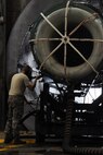 KUNSAN AIR BASE, Republic of Korea -- Senior Airman Kurt Ranes, 8th Maintenance Squadron aerospace propulsion journeyman, performs maintenance on an F-16 Fighting Falcon engine here Aug. 25. The propulsion flight is a centralized repair facility responsible for facilitating maintenance on the jet engine around the clock. (U.S. Air Force photo/Senior Airman Brittany Y. Bateman)