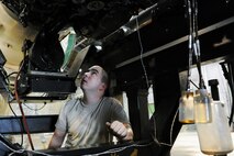 KUNSAN AIR BASE, Republic of Korea -- Senior Airman Eric MacPherson, 8th Maintenance Squadron aerospace propulsion journeyman, performs maintenance on an F-16 Fighting Falcon engine here Aug. 25. The 8th Maintenance Group also provides munitions, aircraft maintenance and maintenance operations support. (U.S. Air Force photo/Senior Airman Brittany Y. Bateman)