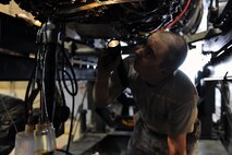 KUNSAN AIR BASE, Republic of Korea -- Senior Airman Eric MacPherson, 8th Maintenance Squadron aerospace propulsion journeyman, takes an oil sample from an F-16 Fighting Falcon engine here Aug 24. The propulsion flight is a centralized repair facility responsible for facilitating maintenance on the jet engine around the clock. (U.S. Air Force photo/Senior Airman Brittany Y. Bateman)