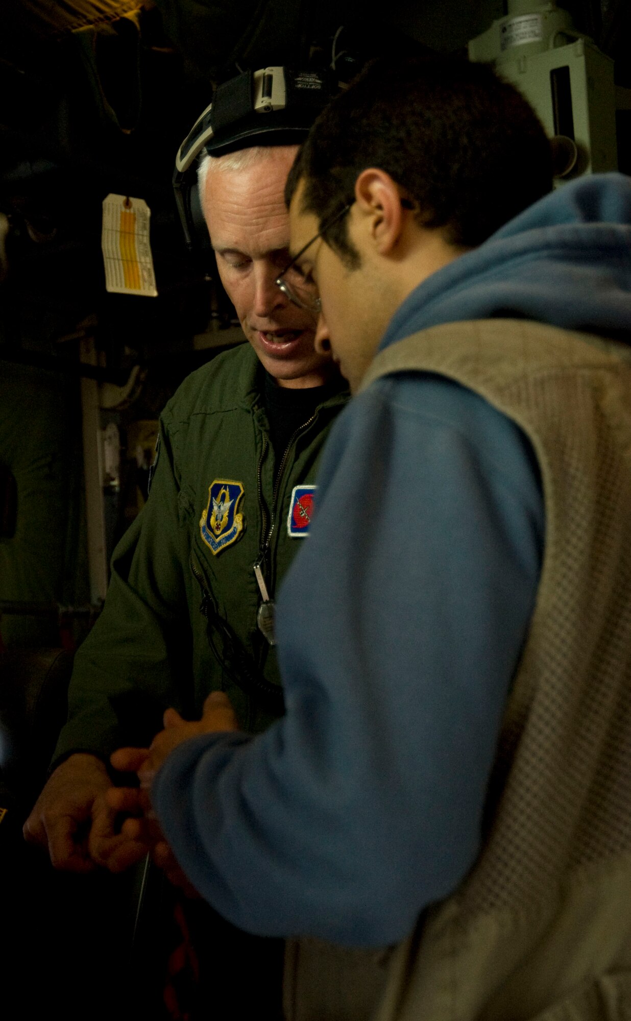 The 53rd Weather Reconnaissance Squadron's chief Aerial Reconnaissance Weather Officer, Lt. Col. Jon Talbot, provides information about Hurricane Irene to Dave Dildine. Dildine is a reporter with WTOP News in Washington, D.C. and was given the opportunity to fly with the Hurricane Hunters on a mission into the eye of Hurricane Irene Aug. 25.