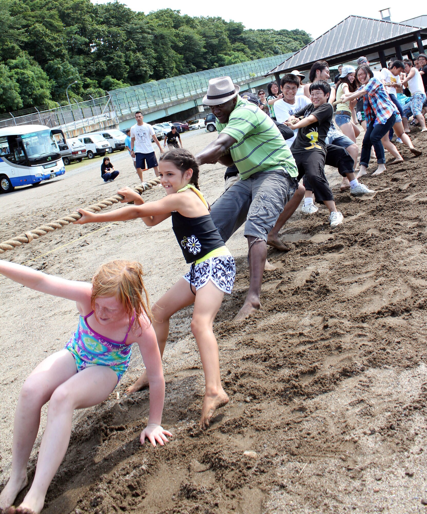 MISAWA AIR BASE, Japan – Members of the 35th Logistics Readiness Squadron play tug-o-war here with children from the Fuji Sei Boen Children’s Home in Aomori City during an annual visit Aug. 20. The school and members of Misawa Air Base have shared partnership for 30 years. (Courtesy photo)