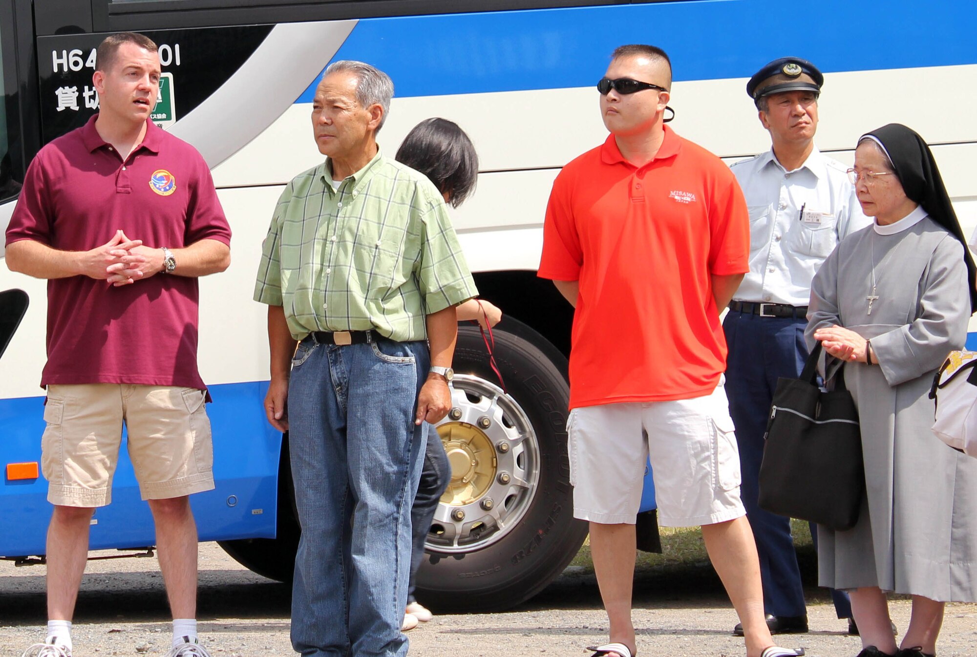 MISAWA AIR BASE, Japan – Major Andrew Pate, far left, 35th Logistics Readiness Squadron commander, greets guests from the Fuji Sei Boen Children’s Home in Aomori City during their visit here Aug. 20. The school and members of Misawa Air Base have shared partnership for 30 years. (Courtesy photo)