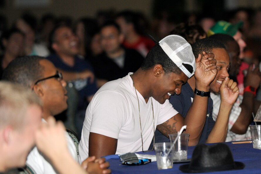 MISAWA AIR BASE, Japan -- Members of the Misawa community break out in laughter during comedy night at the collocated club here Aug. 26. Three comedians traveled here to entertain military members and their families in appreciation for their military service. (U.S. Air Force photo/Tech. Sgt. Marie Brown)