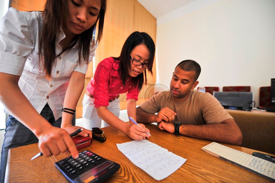 U.S. Air Force Technical Sergeant Eric Moss, contracting officer from the 354th Contracting Squadron, Eielson Air Force Base, Alaska, works with Vietnamese vendors to satisfy contract requirements for improvements to three medical clinics in Ha Tinh Province, Vietnam, on Aug. 22, 2011, in support of Engineering Civic Action Program (ENCAP) Pacific Unity 2011.  The, led by 13th Air Force, operation includes more than 60 U.S. and Vietnamese service members, contractors and support personnel, and helps cultivate common bonds, foster goodwill and improve relationships between the United States and Vietnam.  (U.S. Air Force image/Master Sgt. John Herrick)(Released)