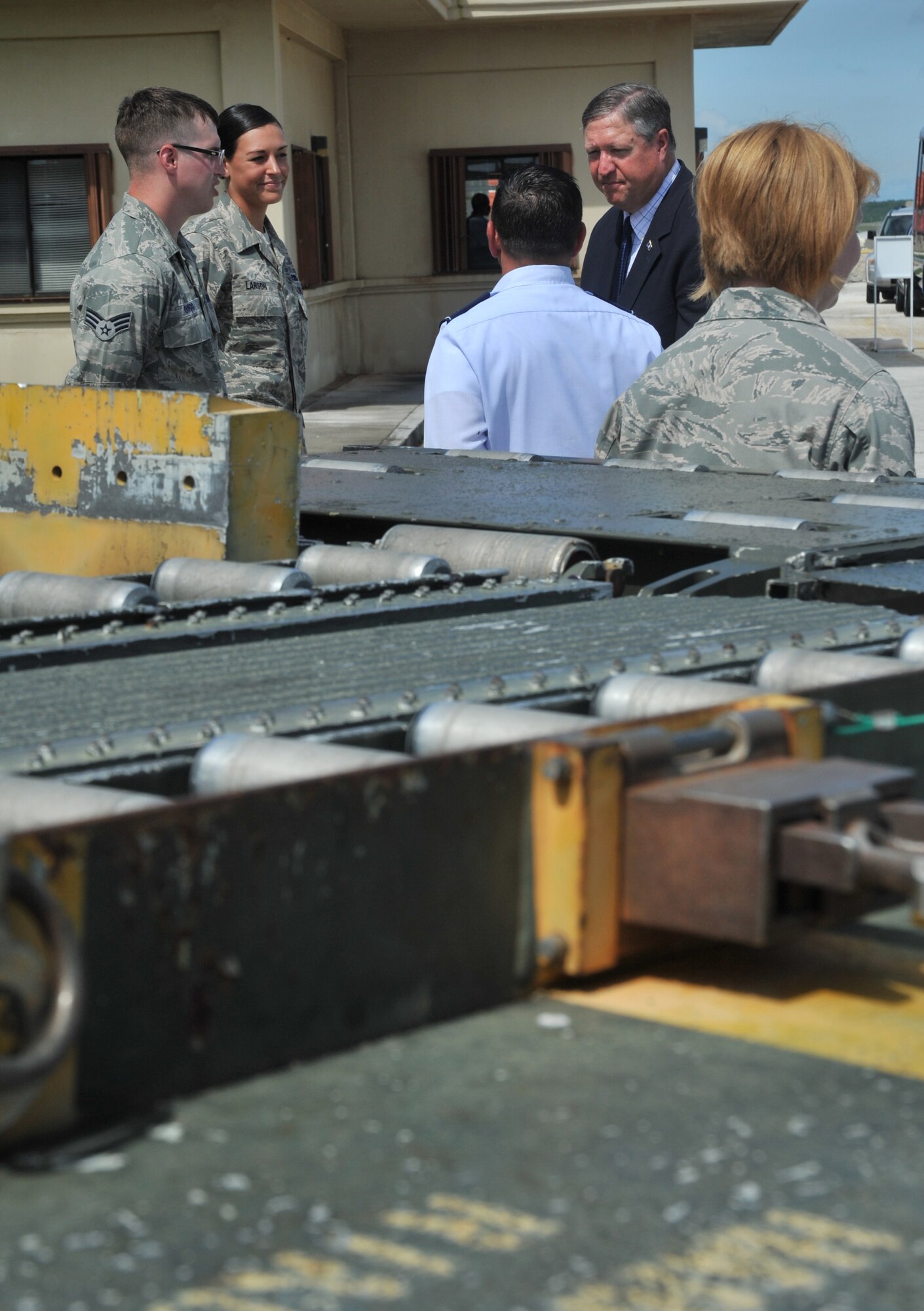Members from the 734th Air Mobility Squadron speak with Secretary of the Air Force Michael during his visit to Andersen Air Force Base, Guam, on Aug. 29, 2011. During the visit, Donley met with senior leaders, and the men and women of the 36th Wing, to discuss the wing’s role in the security and stability of the Asia-Pacific region. (U.S. Air Force photo/Staff Sgt. Alex Montes)