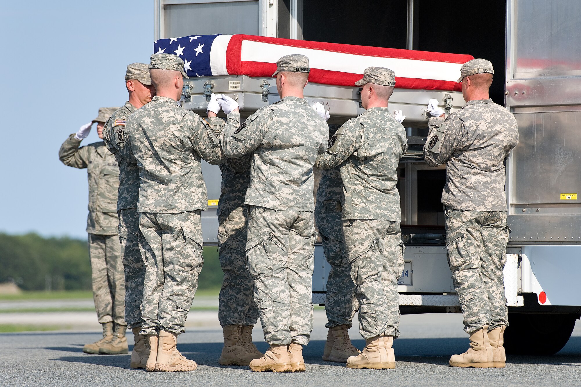 A U.S. Army carry team transfers the remains of Army Cpl. Colby L. Richmond, of Providence, N.C., at Dover Air Force Base, Del., Aug. 29, 2011. (U.S. Air Force photo/Roland Balik)
