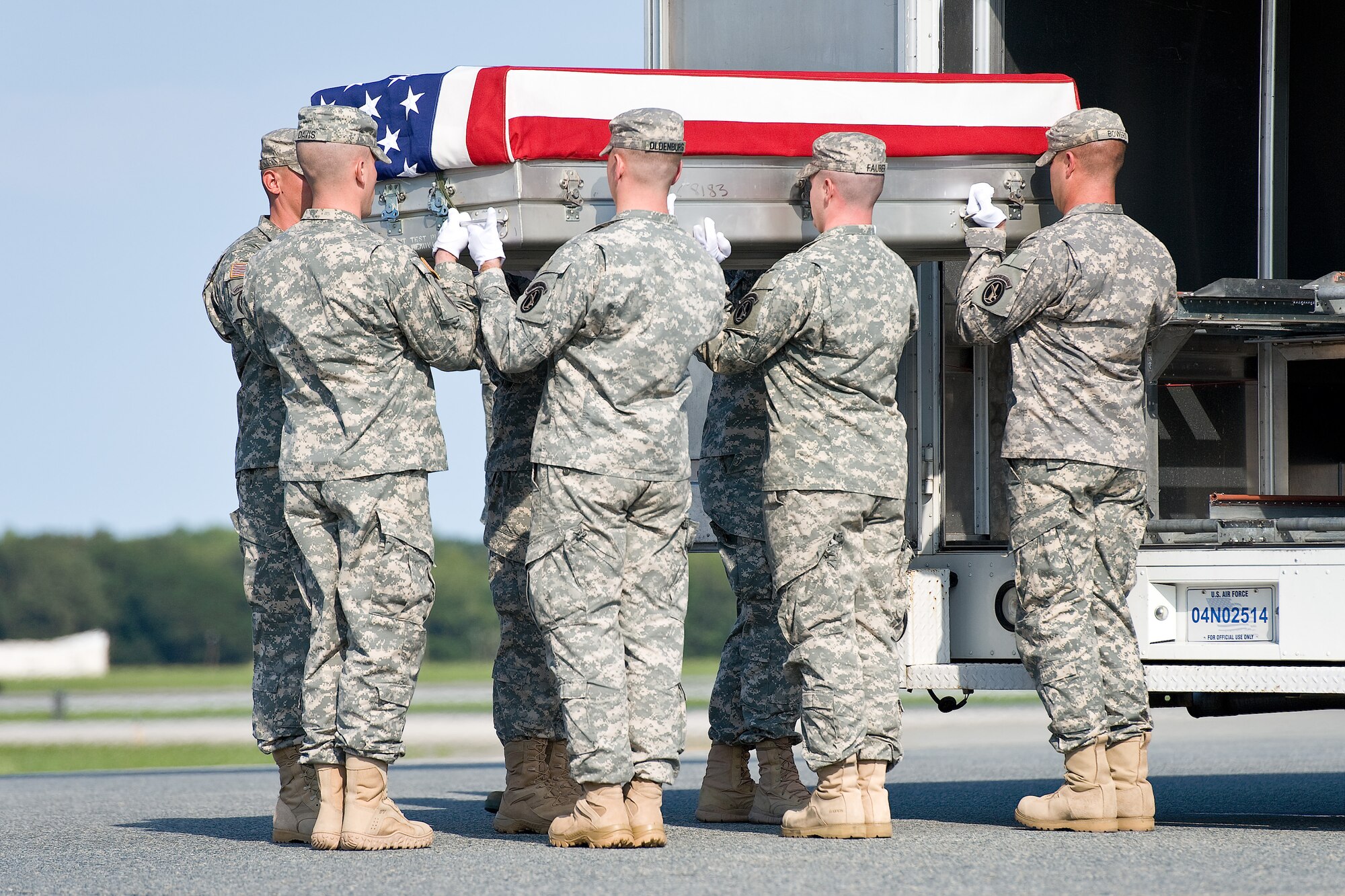 A U.S. Army carry team transfers the remains of Army Sgt. Devin J. Daniels, of Kuna, Idaho, at Dover Air Force Base, Del., Aug. 29, 2011. Daniels was assigned to the 546th Transportation Company, 82nd Sustainment Brigade, XVIII Airborne Corps, Fort Bragg, N.C.  (U.S. Air Force photo/Roland Balik)
