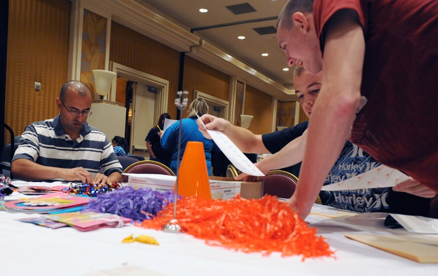 Volunteer Airmen from Barksdale Air Force Base, La., set up for a Special Olympics event in the Eldorado Resort and Casino in Shreveport, La., Aug. 27. The event raised $44,000, which will help the organization purchase sporting equipment and pay for athletes' transportation fees. (U.S. Air Force photo/Airman 1st Class Micaiah Anthony)(RELEASED) 