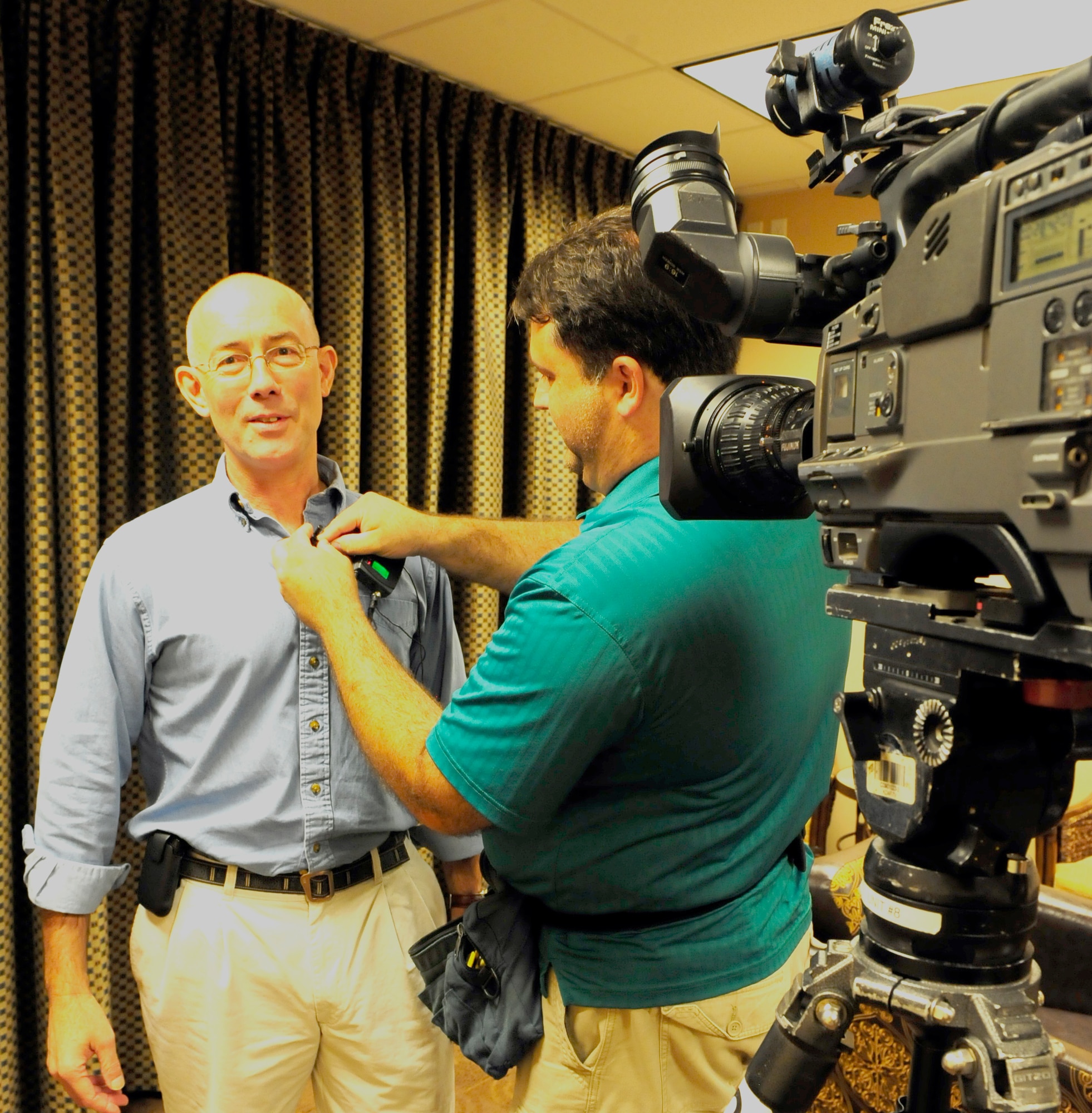 Army Maj. Gen. Charles Luckey prepares for on-camera interview with Dallas-area media. The media covered the Yellow Ribbon event at a Dallas-area hotel August 26 to 27. The Yellow Ribbon Reintegration Program was initiated by Congress in 2008, and offers access to information, resources, and benefits to National Guard and Reserve servicemembers and their families before, during, and after deployments.  (U.S. Air Force photo/Senior Airman Martha Whipple)